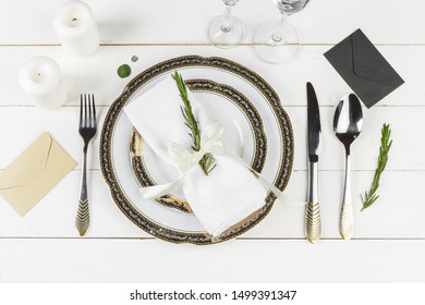 Vintage table setting on wooden table with floral decor - Powered by Shutterstock