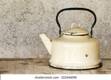 Vintage teapot on wooden background