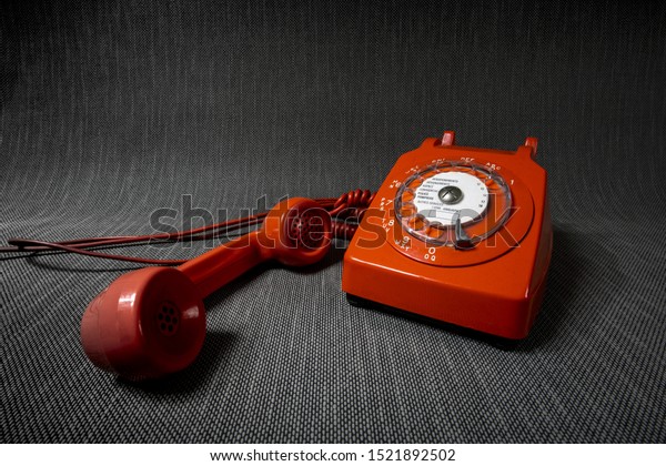 Vintage telephone 1960’s in moody, sinister\
atmosphere.   \

