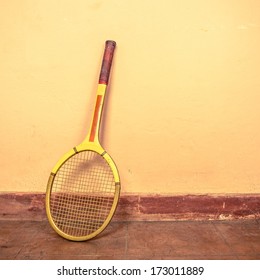 Vintage Tennis Racket Against A Wall