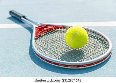 Vintage tennis racket with a ball on the tennis court.  - Powered by Shutterstock