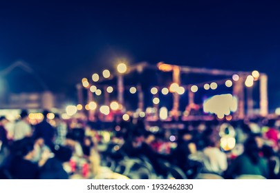 Vintage Tone Abstract Blur Image Of Outdoor Party In Night Time With Light Bokeh For Background Usage .