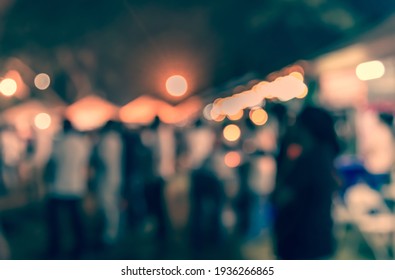 Vintage tone abstract blur image of Outdoor party in night time with light bokeh for background usage . - Shutterstock ID 1936266865