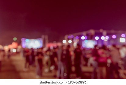 Vintage Tone Abstract Blur Image Of Outdoor Party In Night Time With Light Bokeh For Background Usage .