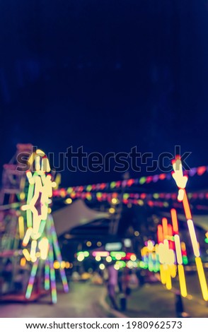 Vintage tone abstract blur image of  Theme park on night time with bokeh for background usage .