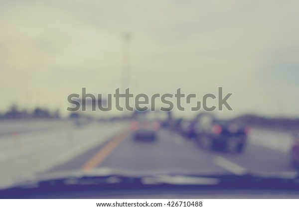vintage tone abstract blur image of\
inside cars with bokeh on day time for background usage\
.