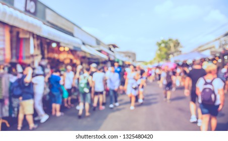 Vintage tone abstract blurred image of People walking at Street  day market with bokeh  for background usage.
