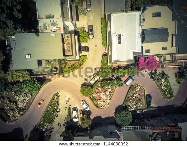 Vintage tone aerial Lombard Street, an east–west\
street in San Francisco, California. Famous for steep, one-block\
section with eight hairpin turns. Crookedest, steep hills, sharp\
curves, one-way road