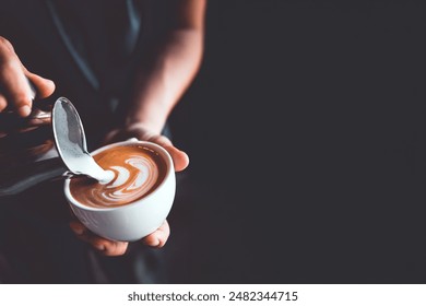 vintage tone of barista pour milk to making latte art coffee at cafe or coffe shop - Powered by Shutterstock