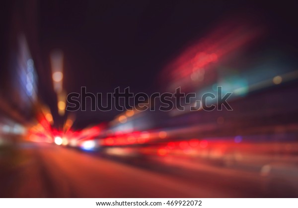 vintage tone blur image of car on street with\
firework in background night\
time.