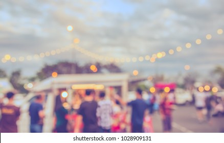 Vintage tone blur image of Food truck at  street night festival with bokeh for background usage . - Shutterstock ID 1028909131