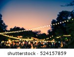 vintage tone blur image of night festival in garden with bokeh for background usage .