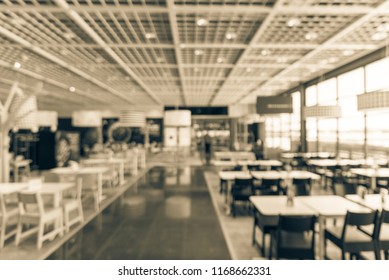 Vintage Tone Blurred Large Open Space Cafeteria, Canteen, Food Court At Shopping Mall Or Corporate In Texas, US. Defocused Modern Public Dining Area With Natural Lights From Windows For Background Use