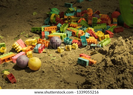 vintage tone of Empty sand yard, toys, jigsaw puzzle The ball, but without children, was abandoned like a lost person.