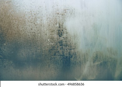 Vintage tone image rain drop foggy glass  Blurred grunge abstract overlay texture background and gradient colors  