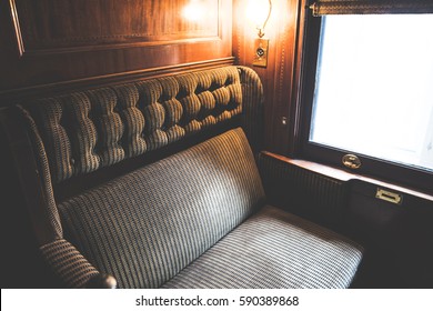 Vintage tone photography of bench seat in the train with window