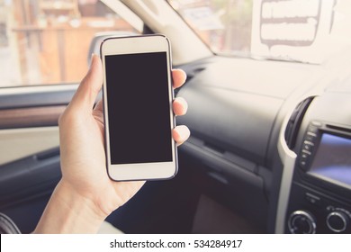 Vintage Tone Picture Of Close-up Man Driver Using Smart Phone In Car