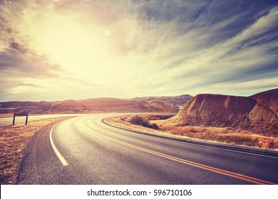 Vintage toned scenic desert highway at sunset, travel concept, USA.