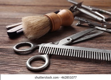 Vintage Tools Of Barber Shop On Wooden Background