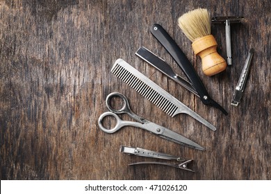 Vintage Tools Of Barber Shop On Wooden Background