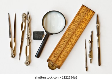 Vintage tools for measurement, drawing, draftsmanship, and graphical works. Isolated on white background. - Powered by Shutterstock