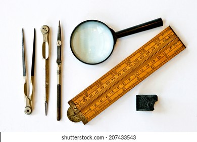 Vintage tools for measurement, drawing, draftsmanship, and graphical works. Isolated on white background.   - Powered by Shutterstock