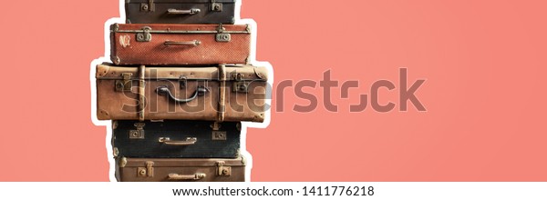Vintage tower pile ancient\
suitcases. Travel concept luggage design. Long banner format blue\
background