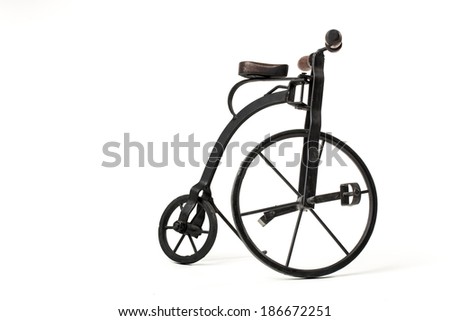 vintage toy velocipede isolated in white