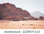 Vintage train in desert. Tourist adventure ride experience Hijaz railway train from 1916. Great arab revolt fighters attack in wadi rum. Popular activities Jordan
