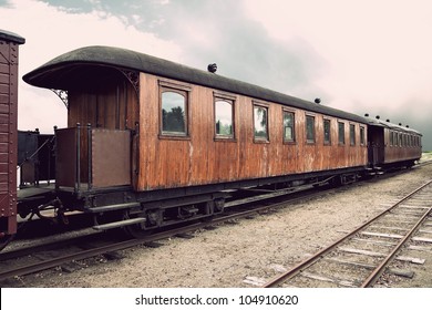vintage train with wooden cars in sepia tone