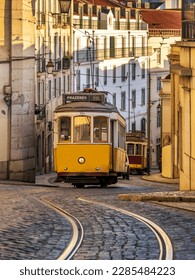 Vintage trams on Calçada São Francisco in the Chiado district, Lisbon, Portugal.