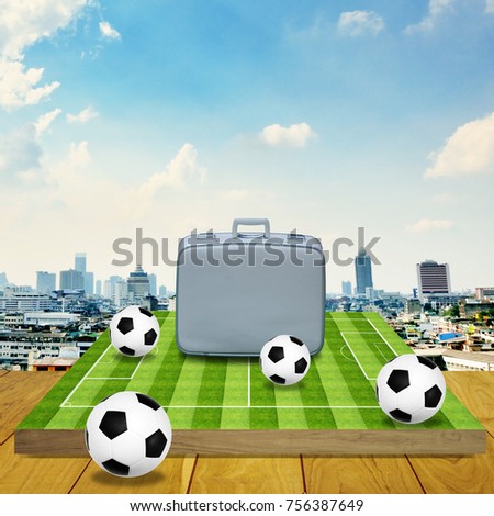 Vintage travel bag on football game board with cityscape background, Travel for sport concept