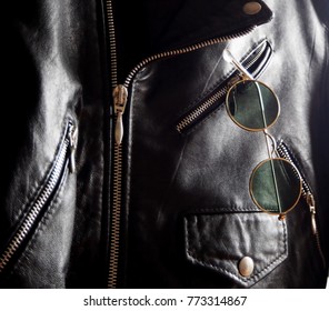 Vintage Trendy Sunglasses In A Pocket Of A Studded Jacket