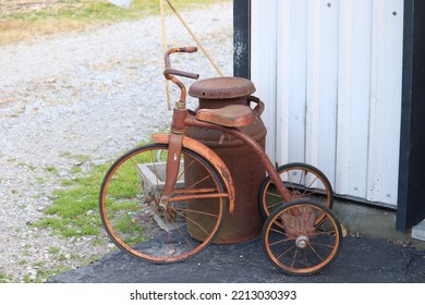 Vintage Tricycle And Milk Jug By The Barn