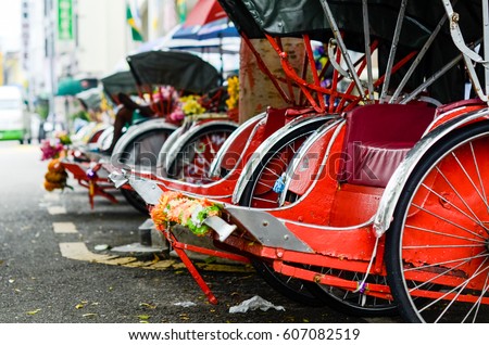 Vintage Trishaw stop beside road for service traveller