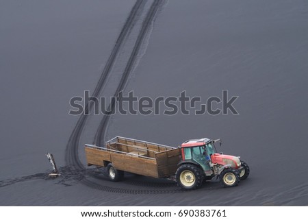 vintage truck and its tire track on black sand in Iceland