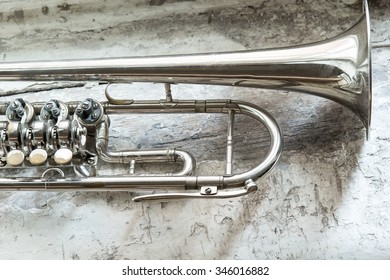 vintage trumpet on wooden background