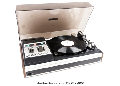 Vintage turntable record player with dust cover isolated on white background.