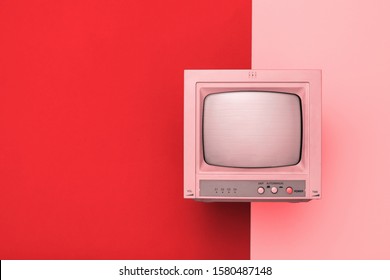Vintage TV with kinescope on a two-tone background. Tinted image of retro electronics.