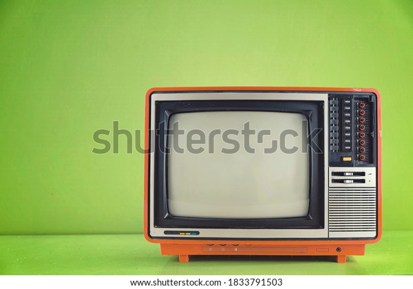 Vintage TV set isolated. Retro television - Old\
vintage  red television isolate on white, retro technology. Ancient\
tv concept.