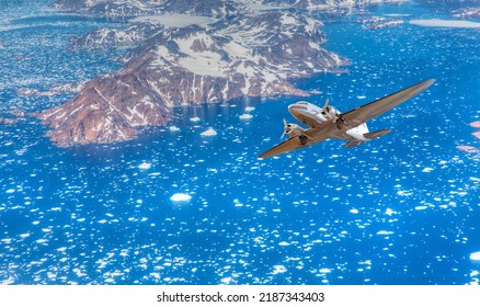 Vintage Type Old Metallic Propeller Airplane In The Sky - View From Airplane Of Melting Polar Ice Cap And Snowy Mountains - Greenland