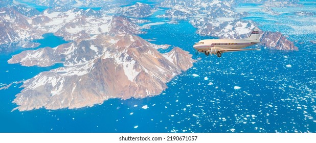 Vintage Type Old Metallic Propeller Airplane In The Sky - View From Airplane Of Melting Polar Ice Cap And Snowy Mountains - Greenland