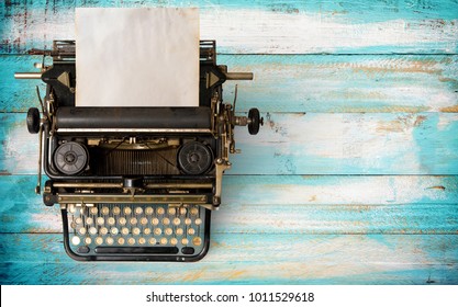 Vintage typewriter header with old paper. retro machine technology - top view and creative flat lay design. 