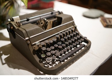 Vintage typewriter machine in a white table.
