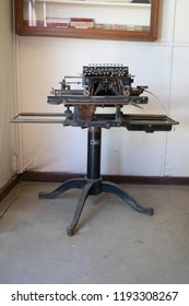 Vintage Typewriter On Pedistal In A Room