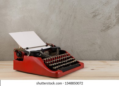 Vintage Typewriter On The Table With Blank Paper On Wooden Desk - Concept For Writing, Journalism, Blogging