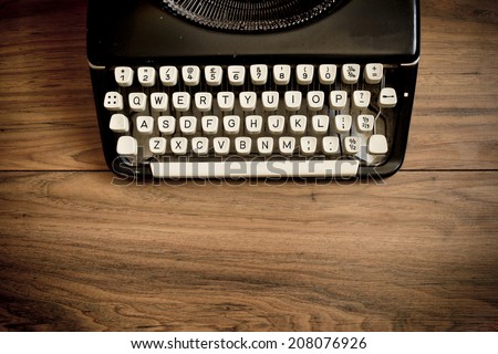 A Vintage Typewriter on a wooden table.