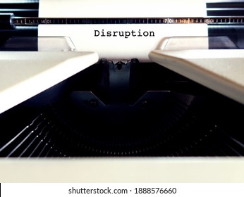 A Vintage Typewriter With Paper Feeding And Text Typed DISRUPTION, Concept Of Radical Transition Change To Industry Due To Technology Innovation