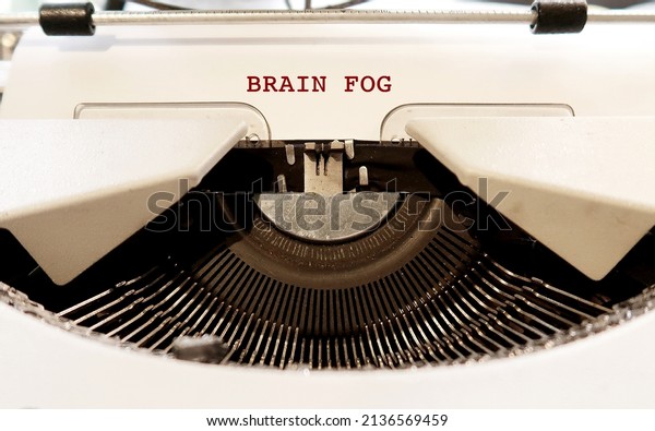 Vintage\
typewriter with typed text BRAIN FOG, a term used to describe\
feelings of mental fuzziness, occurs when the brain is overworked\
or under strain, inability to think\
clearly
