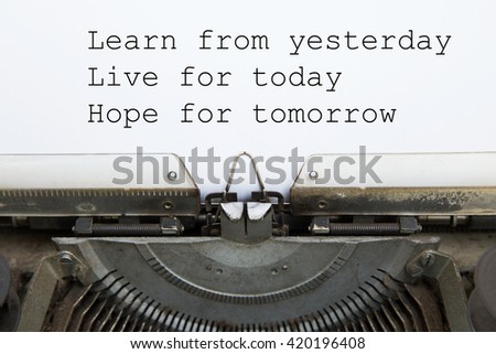 vintage typing machine and white blank paper with words "learn from yesterday, live for today, hope for tomorrow"